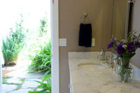 One of the bathrooms at Cliffside Malibu’s Alchol Rehab Center, leads out to a beautiful garden