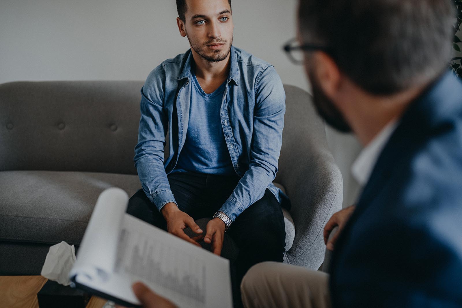 Two men talking about alcohol addiction treatment, a treatment center in Malibu, California.