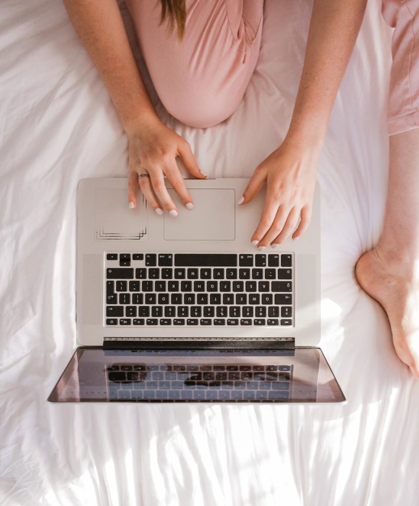 Woman on a laptop at Cliffside Malibu, an addiction treatment center in Malibu, California.