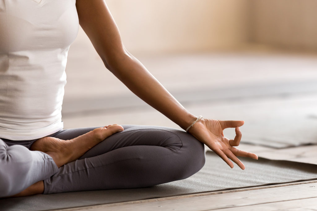 Woman doing yoga and practicing mindsight at Cliffside Malibu, an addiction treatment center in Malibu, California.
