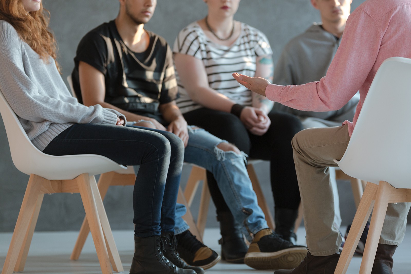 Group of people sitting in chairs at group therapy at Cliffside Malibu, an addiction treatment center in Malibu, California.