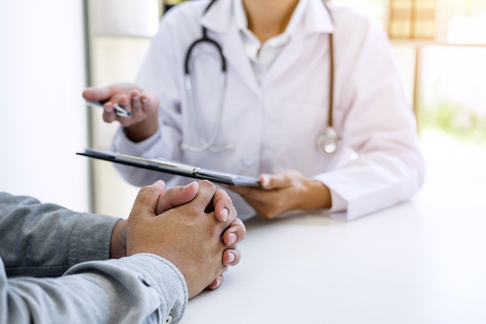 Neurobiology and Addiction, talking to a doctor in a white lab coat.