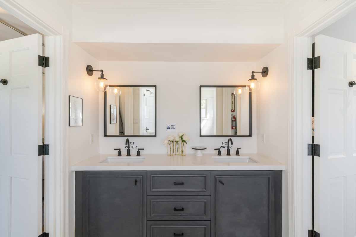 Bathroom in Sunset Malibu, a residential treatment center in Malibu, California. Two sinks and two mirrors over a counter top in a bathroom.
