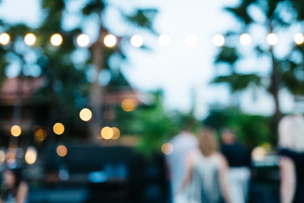 blurred-outdoor-gathering-with-string-lights-at-ev-2026-09-23-02-14-52-utc