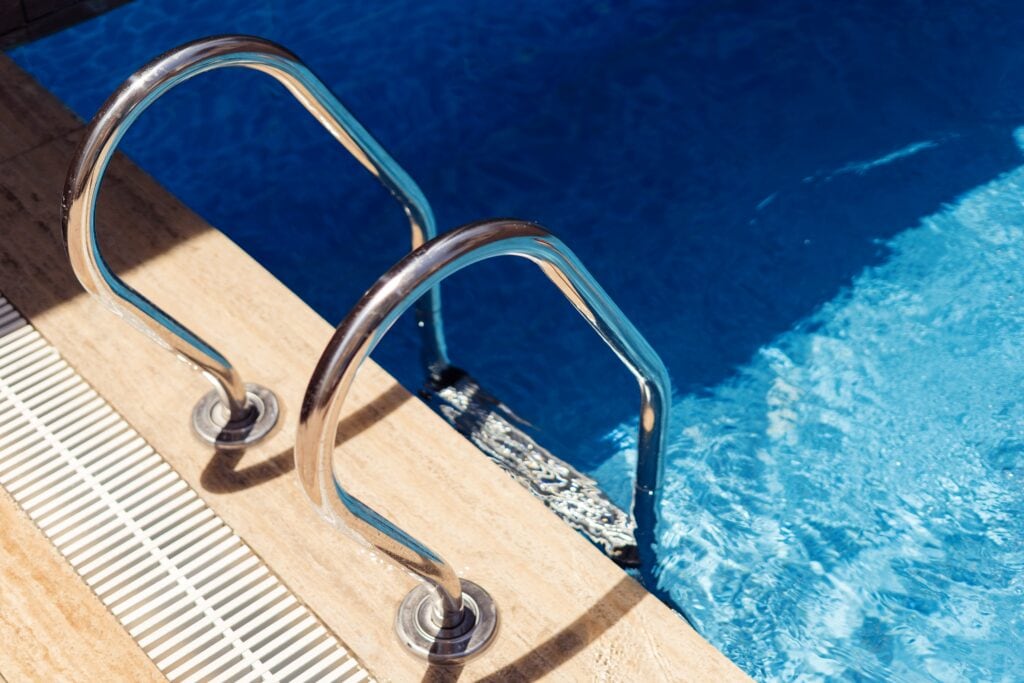 sparkling-pool-water-with-ladder-and-beige-tiles-2026-09-22-16-40-53-utc