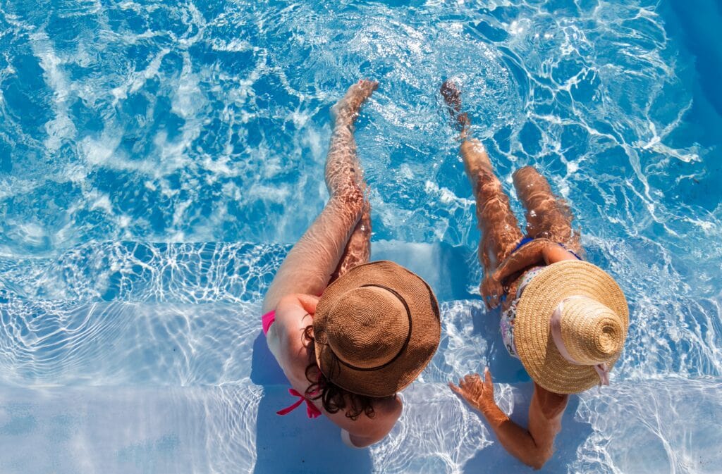 women-relaxing-in-blue-swimming-pool-water-2026-09-21-06-27-21-utc